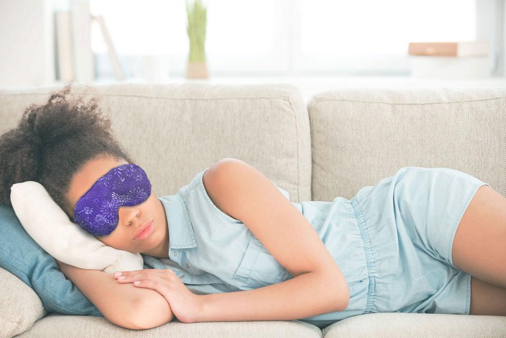 A woman sleeping with a Lavender Eye Mask for Natural relief and relaxation - Nature Creation